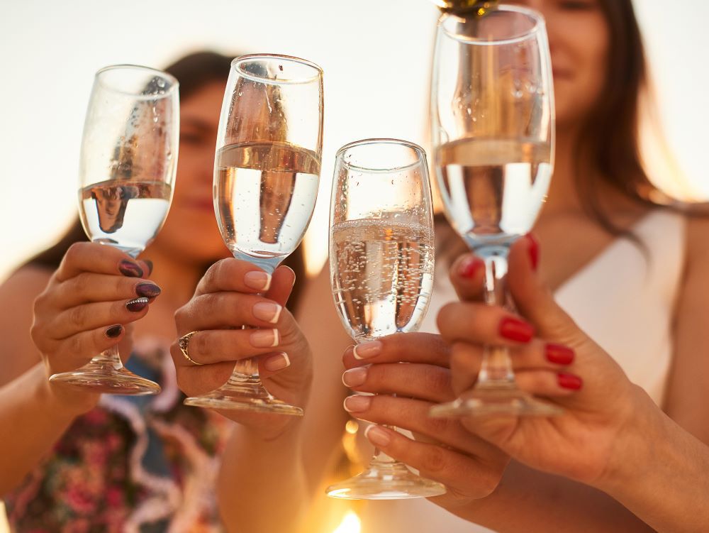 Friends toasting with bubbly in champagne glasses