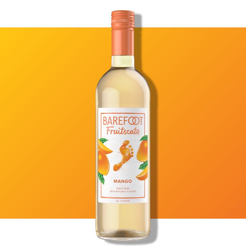 Barefoot Fruitscato Mango bottle against a bright orange background with mango imagery on the label.